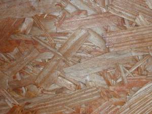 particle board detail, showing the mashed up pieces of wood.