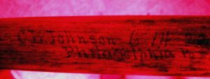 Hidden writing revealed on a turn of the 20th century baseball bat.  The text was written on their by the manufacturer when the player returned the broken bat for a new one.  The written information and provenance helps authenticate the bat as game used by the player.